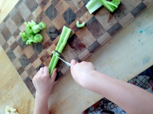 Chopping, a pairing knife works well for little hands. 