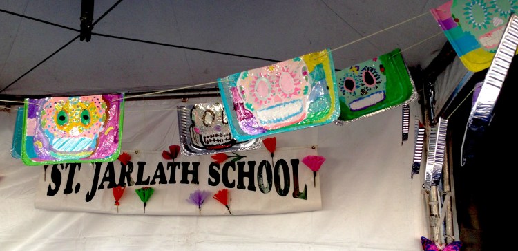 The kids running this booth were amazing. They were so proud of their art work, and for good reason. I love the idea of using pans as the canvas for these calaveras paintings.